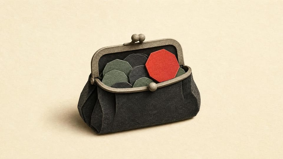 An open charcoal purse releasing one red token from its reserve.