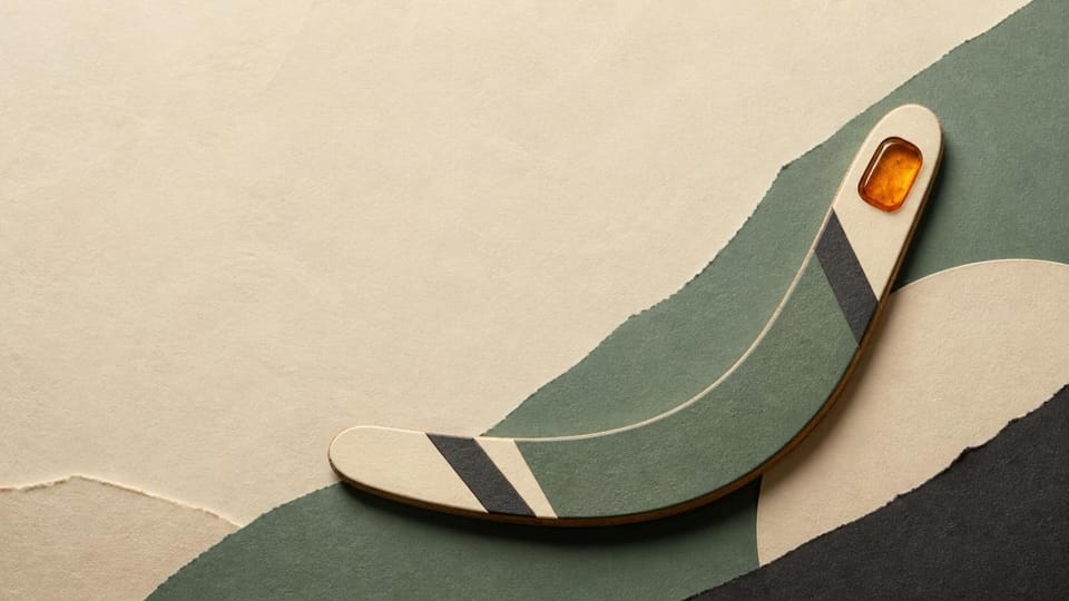A paper boomerang with a visible amber reserve curves back through open space.